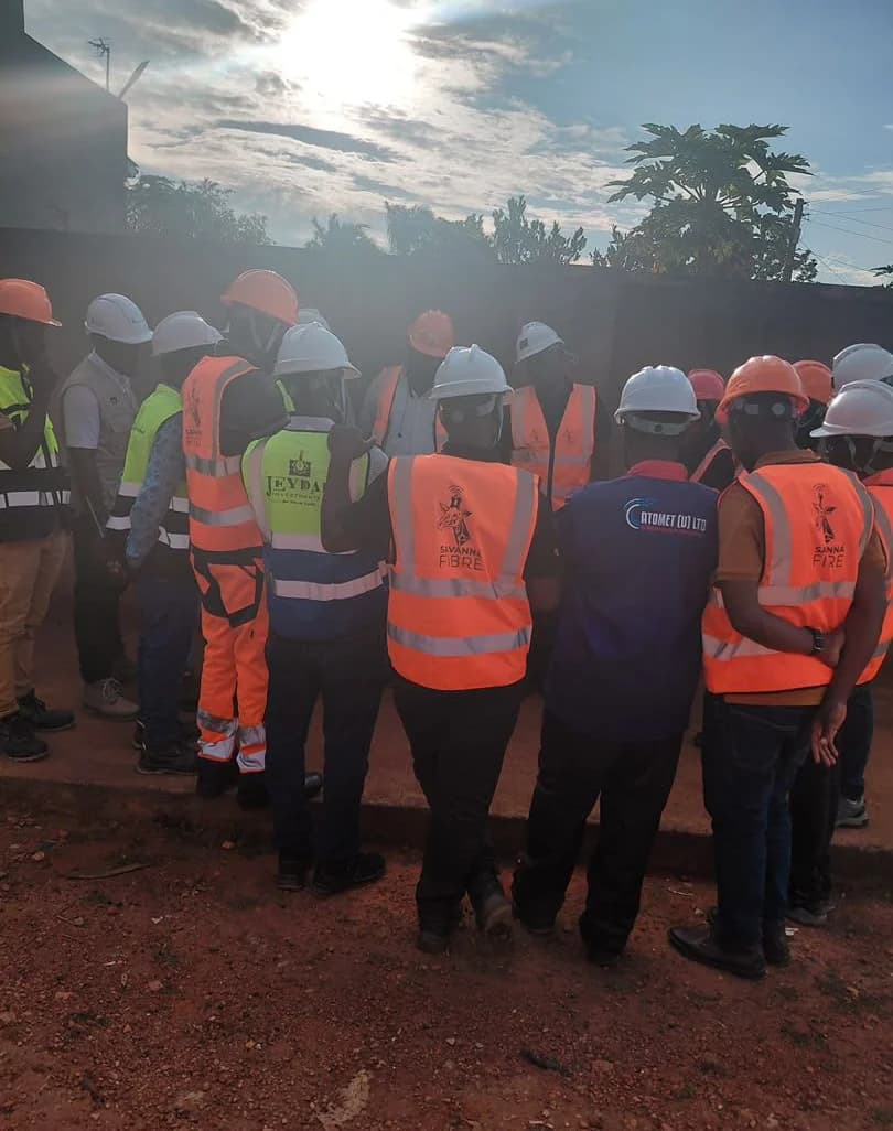 Crews from several contractors in hard hats and high-visibility vests gathered for a site briefing